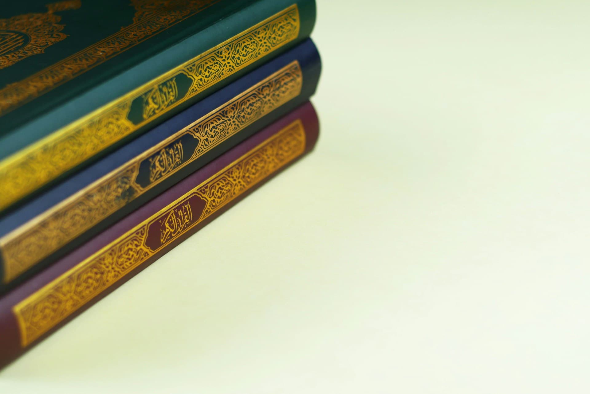 A collection of Qurans with ornate covers